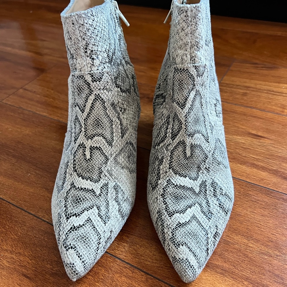 Beautiful phyton booties. Great addition to your closet. Great with dresses.